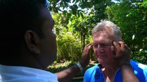 Paul experiencing some Ayurveda treatment at the spice and herb garden.